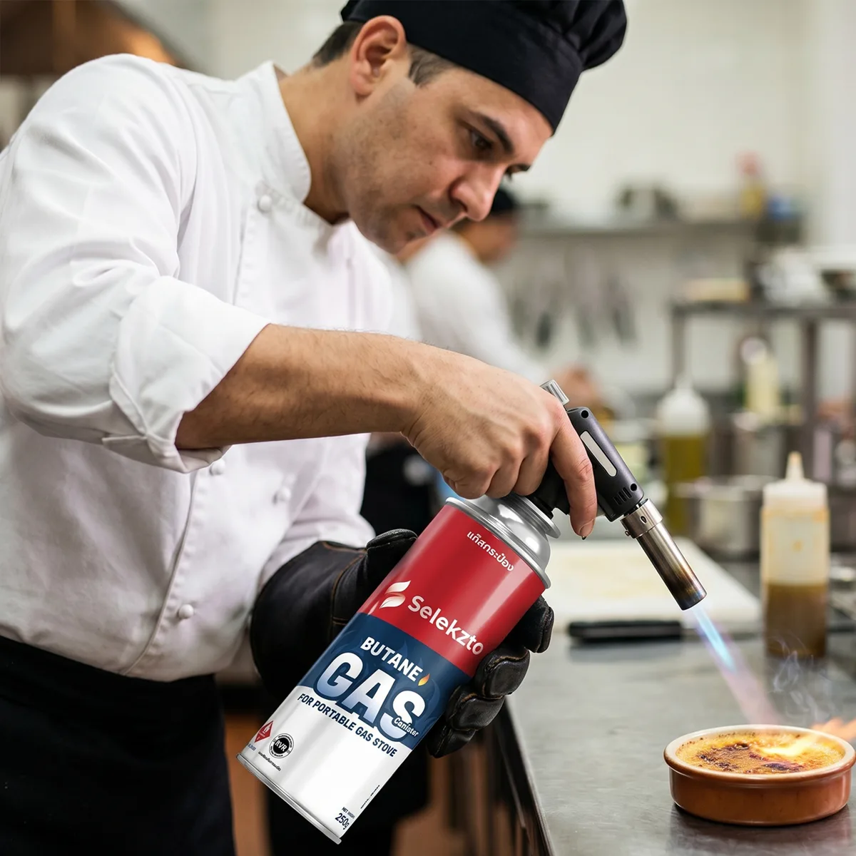 Chef torching crème brûlée with a Selekzto gas canister in a restaurant kitchen